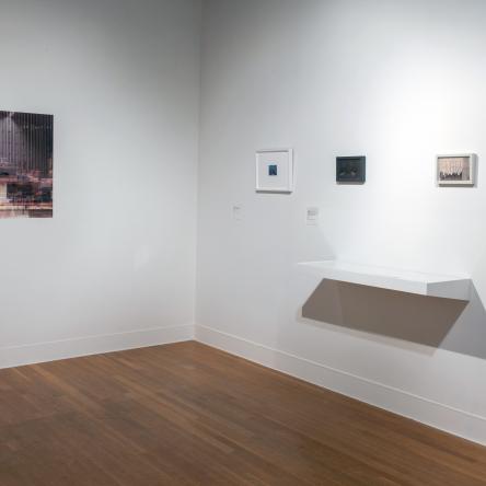 corner of the gallery with each side featuring small photographs