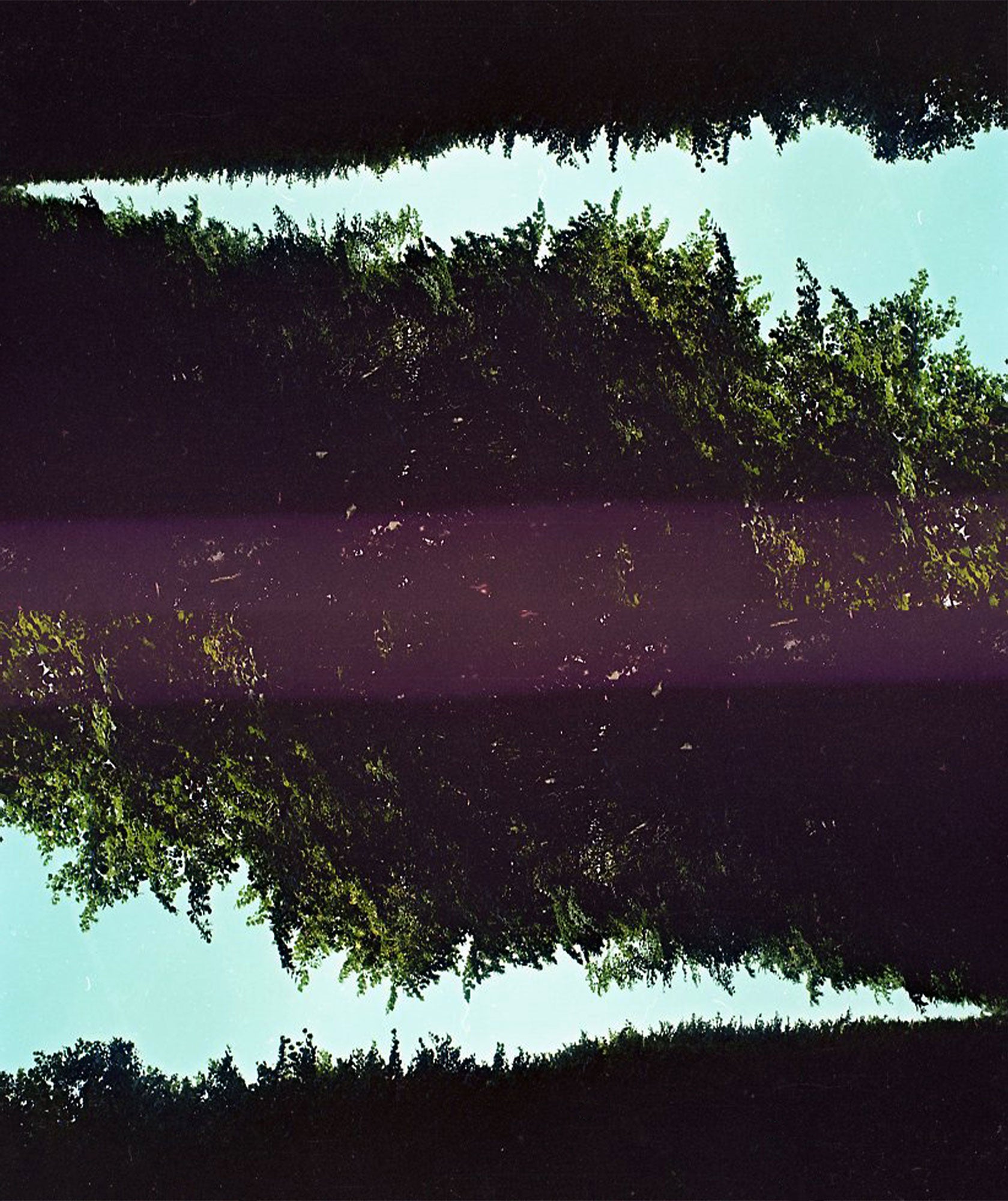 image of what appears to be surface of water with purple hue