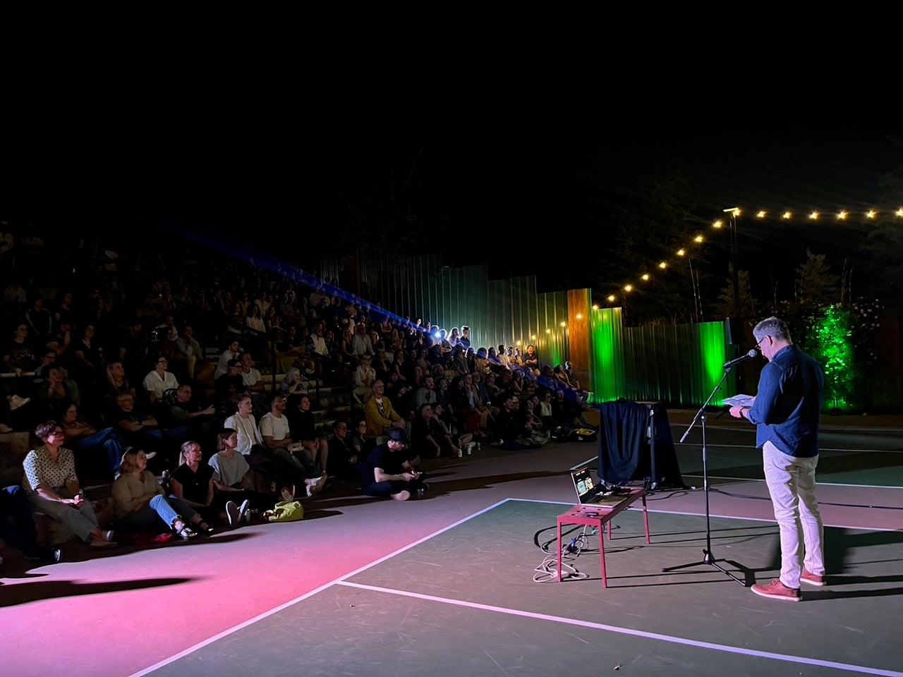 image of a person presenting to a crowd