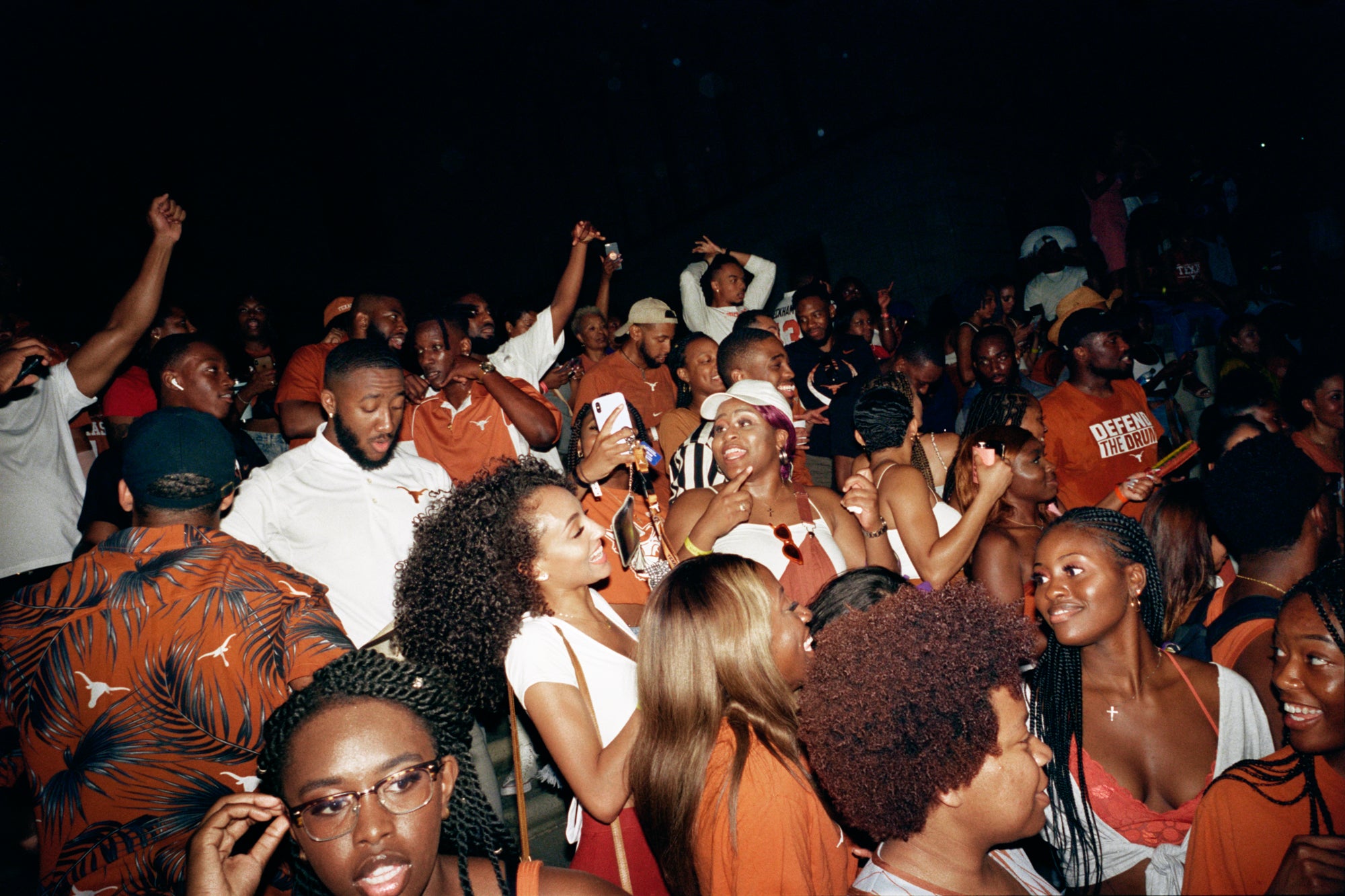 Photo of Black students at the University of Texas at Austin at a party for what seems to be UT's homecoming. 