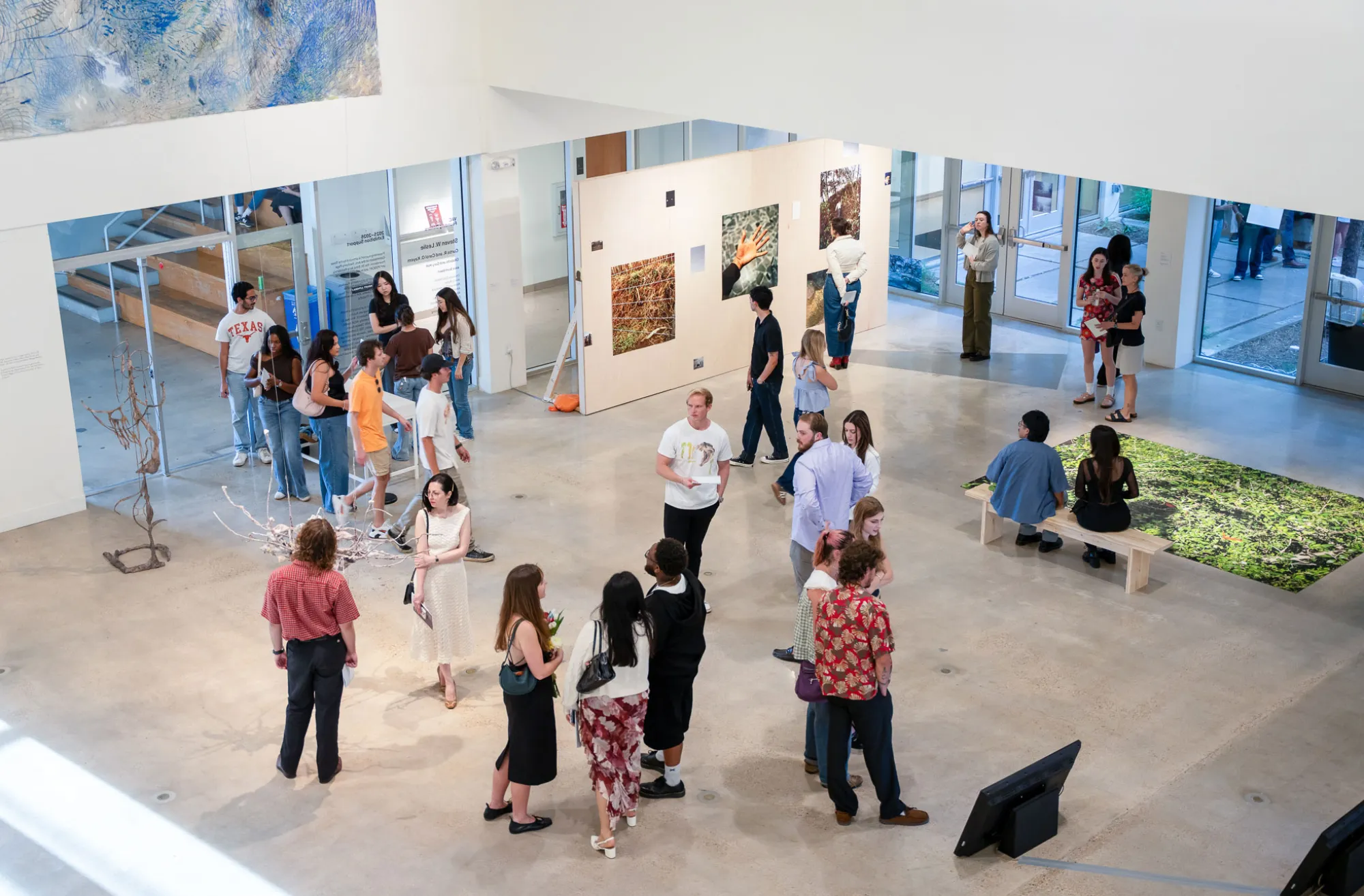 people in gallery during art opening