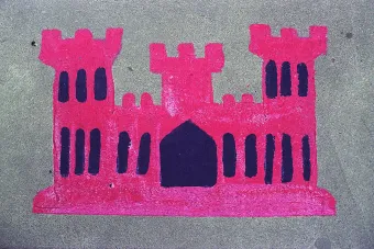 chalk drawing on a sidewalk of a pink castle