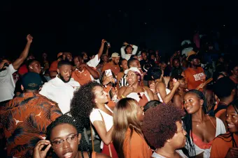 Photo of Black students at the University of Texas at Austin at a party for what seems to be UT's homecoming. 