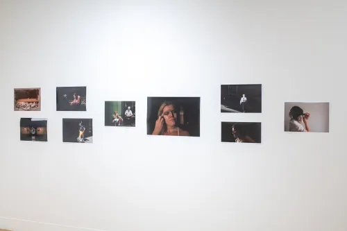 gallery image of photo graphs hung on a single wall