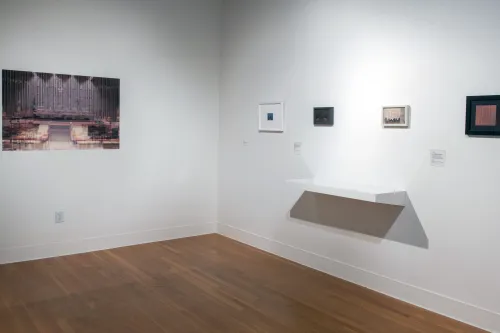 corner of the gallery with each side featuring small photographs