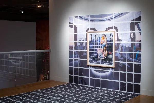 Installation view of El Otro Lado. Framed photographs and PhotoTex on walls.