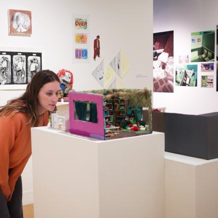 image of person looking at work in a gallery 