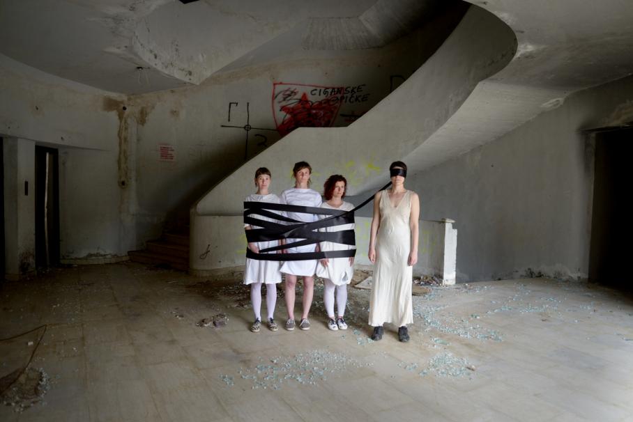 Alyssa Taylor Wendt, Visual Arts Center, photo of 4 blindfolded women in abandoned building, bound in black tape