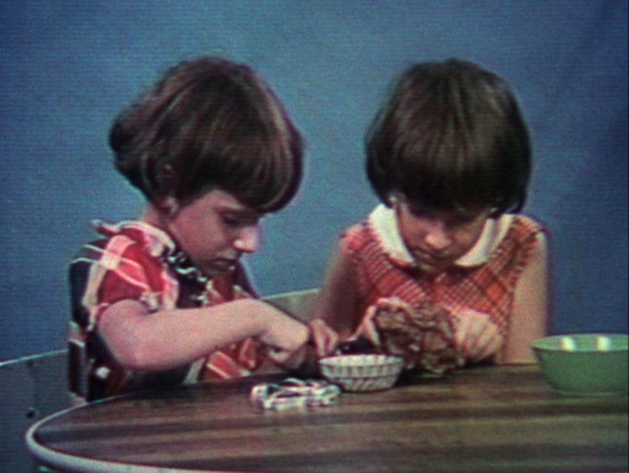 Poto and Cabengo, Visual Arts Center, film still of two young twin girls playing at table