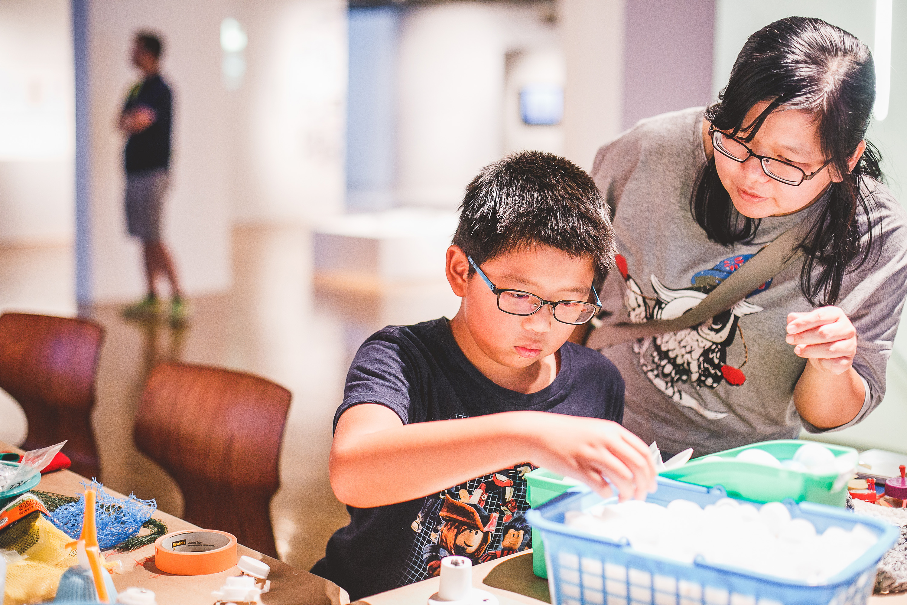 family participating in activities at art gallery