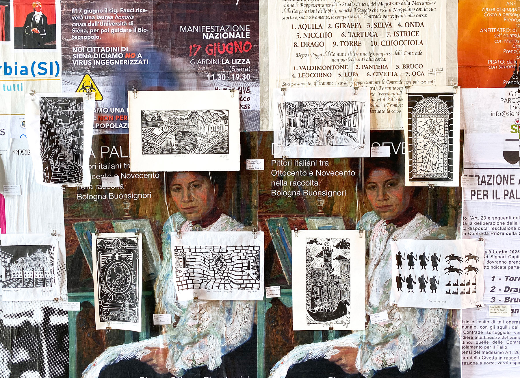 student artworks displayed against a wall covered in flyers