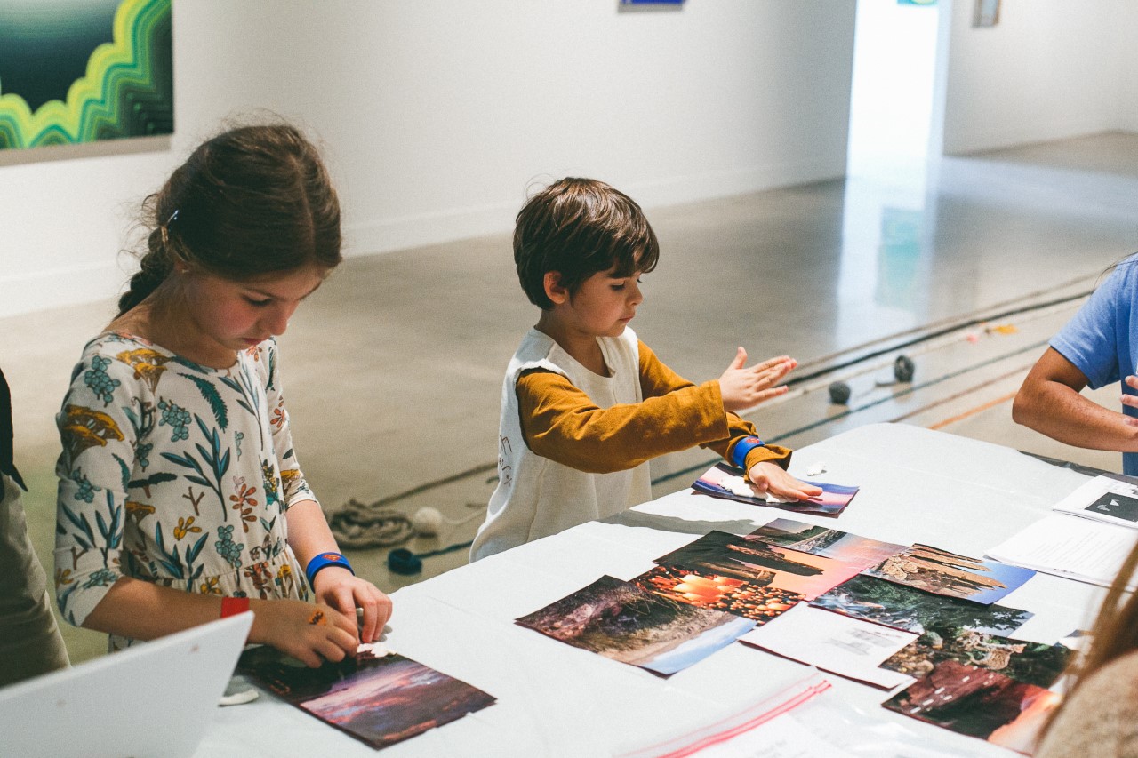 two children participating in an art activity in the VAC