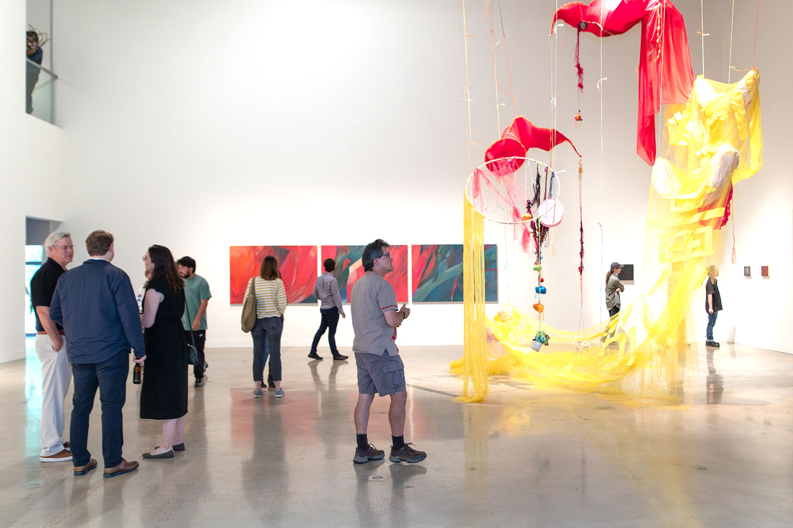 people in gallery during art opening