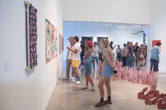 people in gallery during art opening