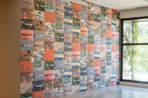 wall filled with images of machetes on the ground