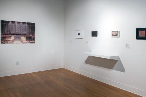corner of the gallery with each side featuring small photographs