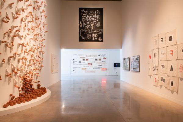 image of hallway in gallery with work on all three sides