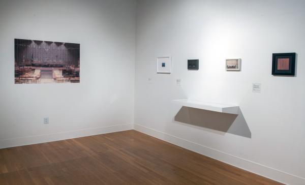 corner of the gallery with each side featuring small photographs