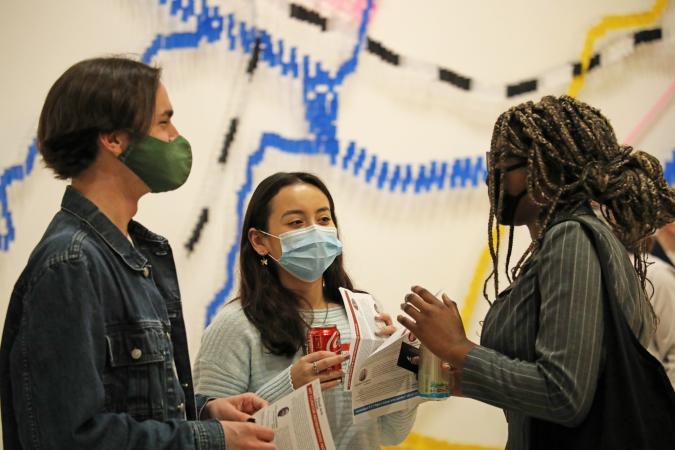 people talking at art gallery event