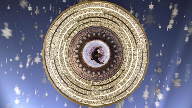 composite image: human figure seen from above in concentric gold circles against blue background