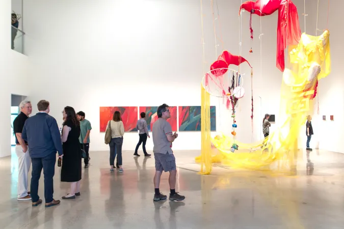 people in gallery during art opening