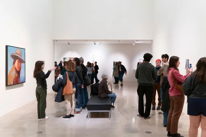 people in gallery during art opening